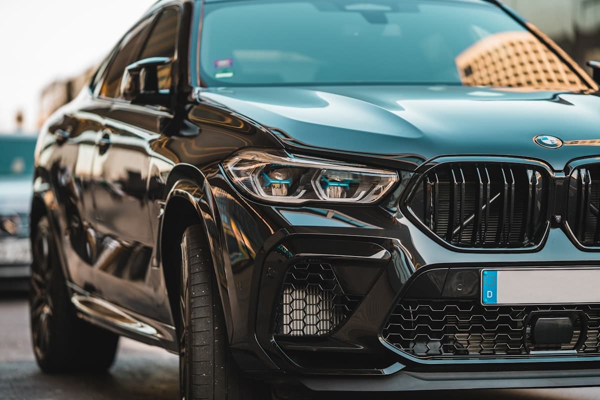 Black BMW coupe with mirror-finish paint