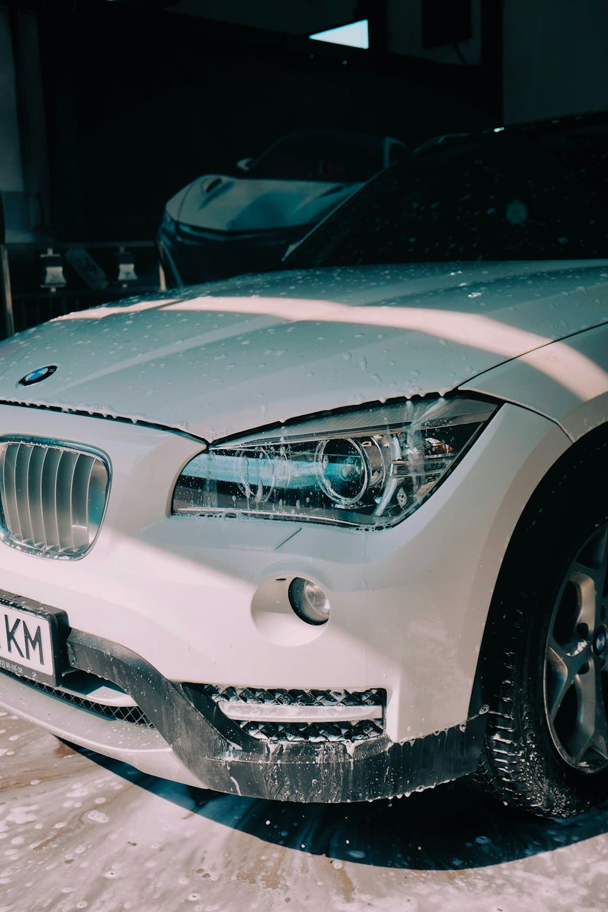 White BMW SUV at mobile wash station